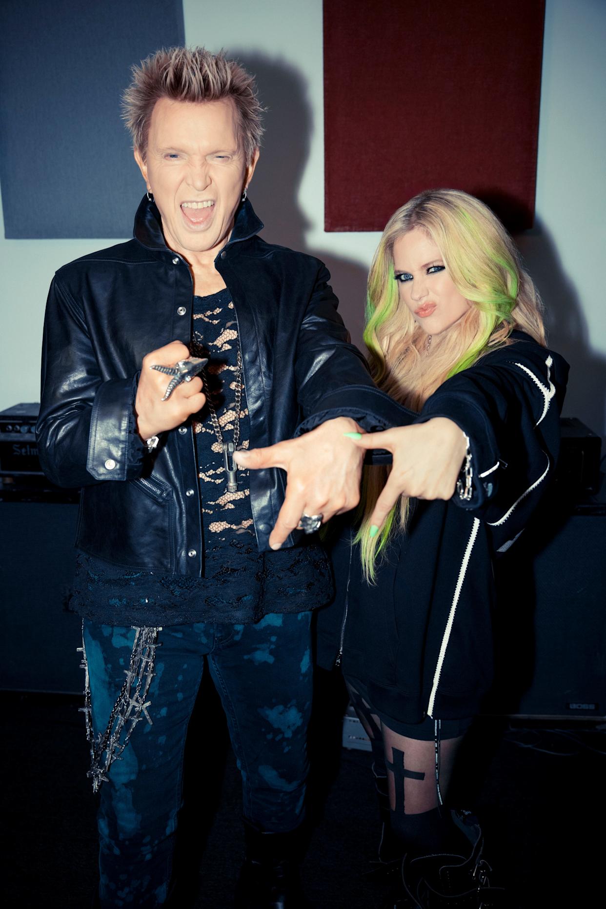 Billy Idol performing live, showcasing his signature punk style