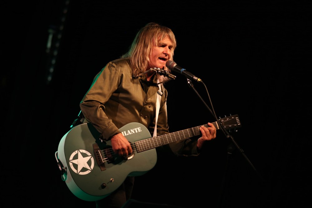 Mike Peters performing on stage with The Alarm