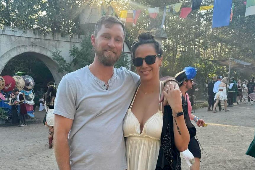 Kristen Doute smiling at her baby shower surrounded by friends