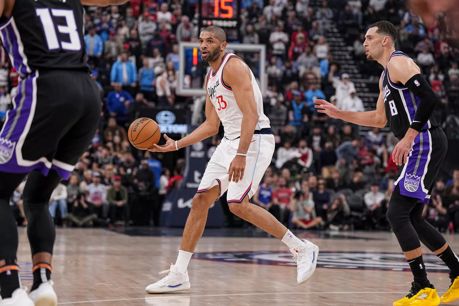Nicolas Batum during an NBA game, representing strength and dedication.