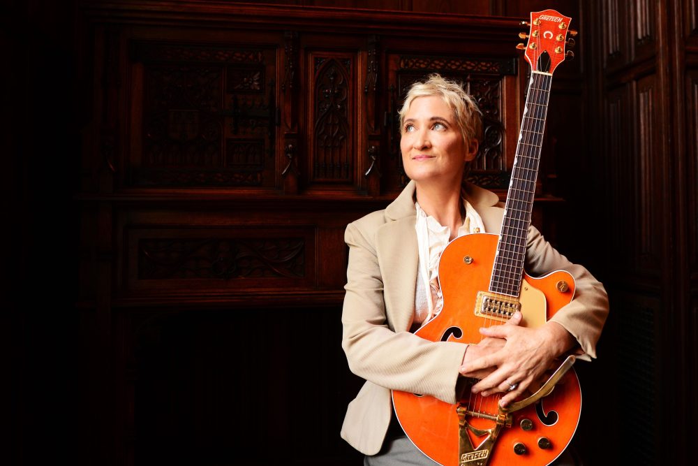 Jill Sobule performing on stage, remembered for her musical legacy