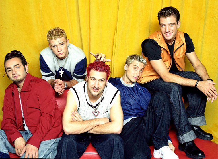 Joey Fatone performing on stage with NSYNC, highlighting his pop culture legacy