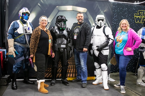 Star Wars fans celebrating May the 4th be with you at a fan convention