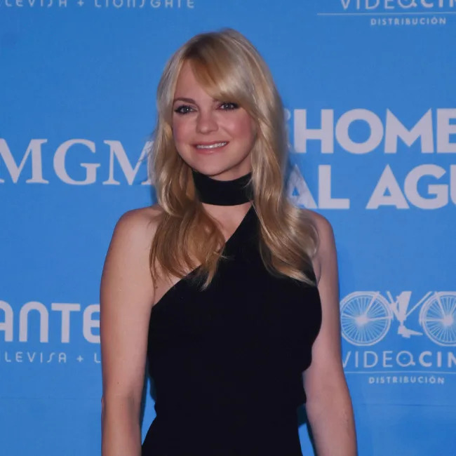 Anna Faris smiling alongside her son Jack at an outdoor event