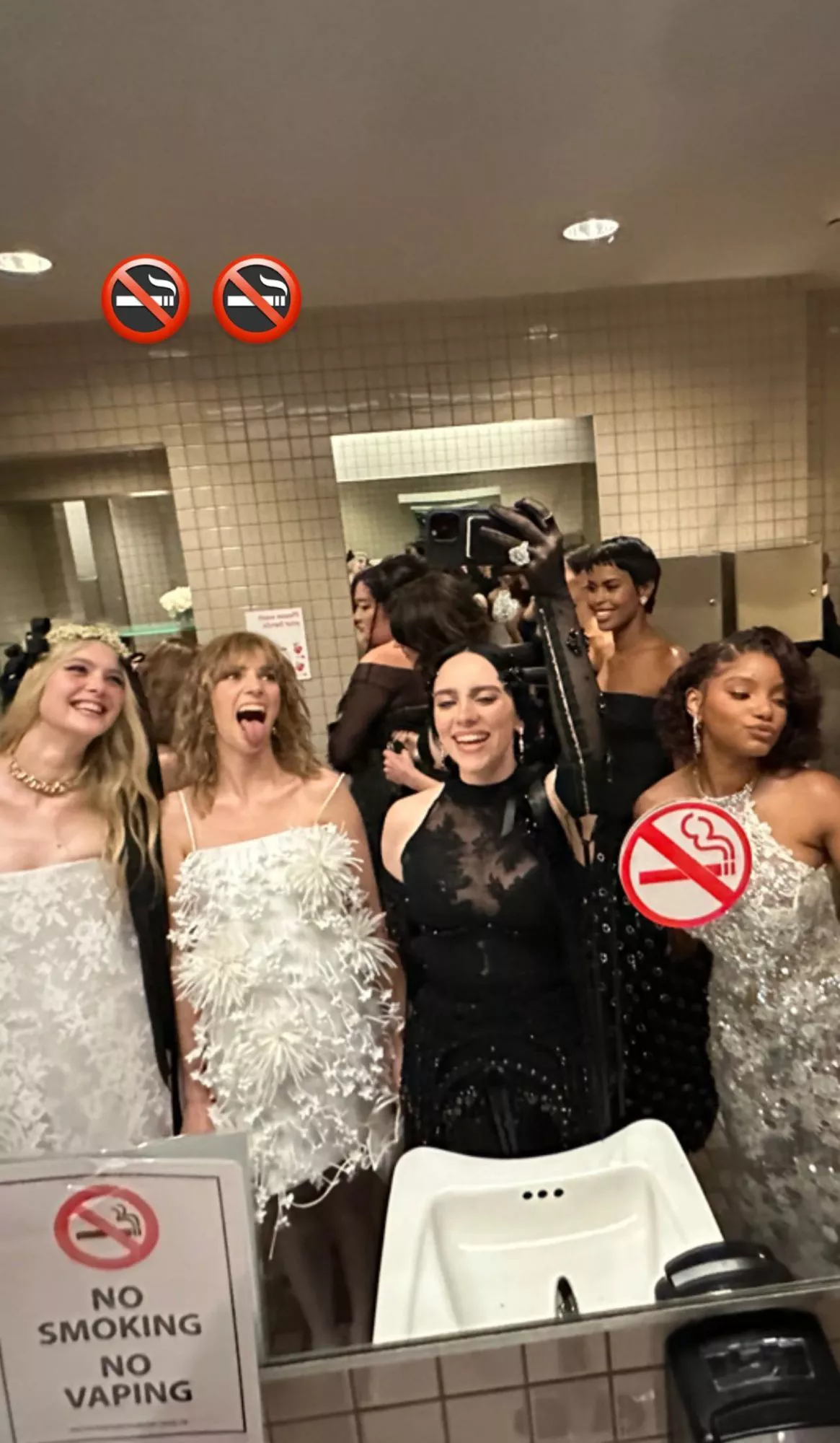 Halle Bailey at the 2025 Met Gala in a Coach mini suit-dress and black beaded veil
