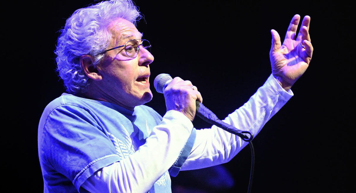 Roger Daltrey performing live, a legendary singer known for his stance on playing specific songs