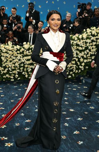 Kim Kardashian on the Met Gala 2025 red carpet, showcasing tailored fashion.