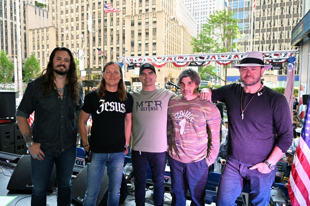 3 Doors Down band members performing live