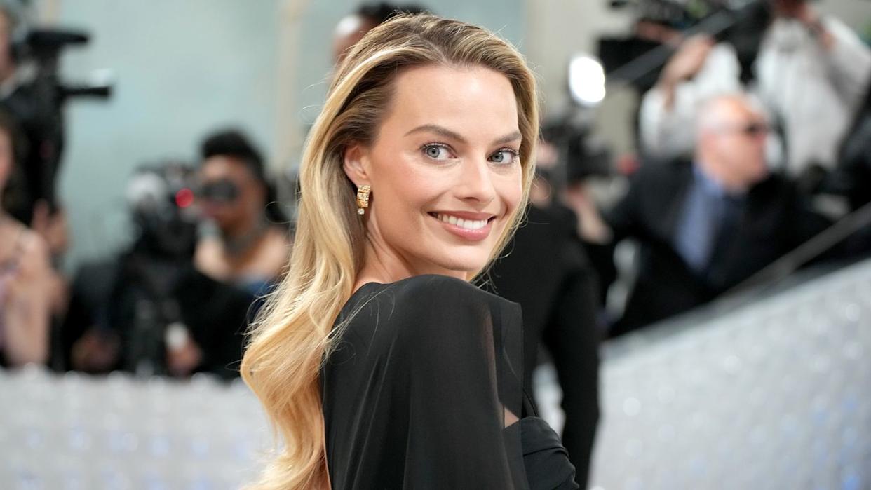 Margot Robbie at a 2025 public event, exemplifying her style and charm
