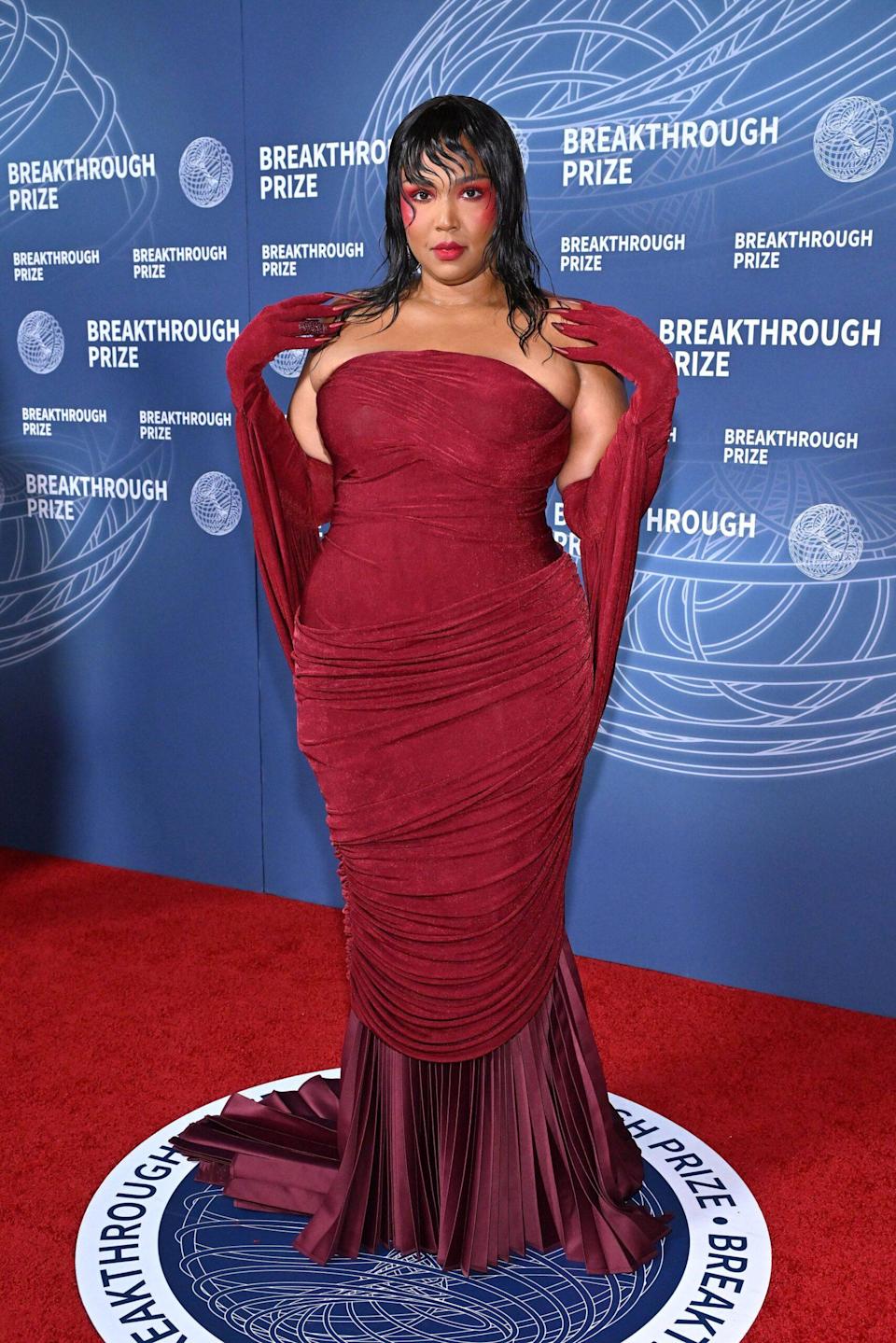 Lizzo at the 2025 Met Gala in a curve-hugging black and white gown