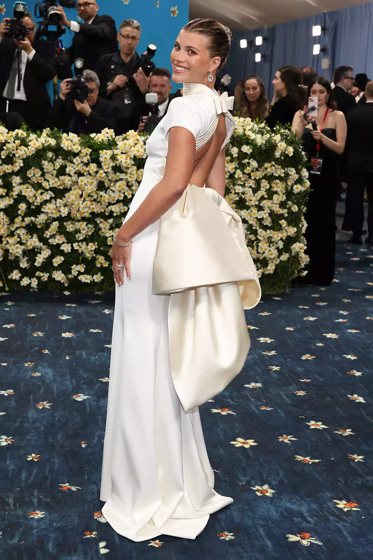 Sofia Richie Met Gala 2025 red carpet look featuring a Tommy Hilfiger gown with bow
