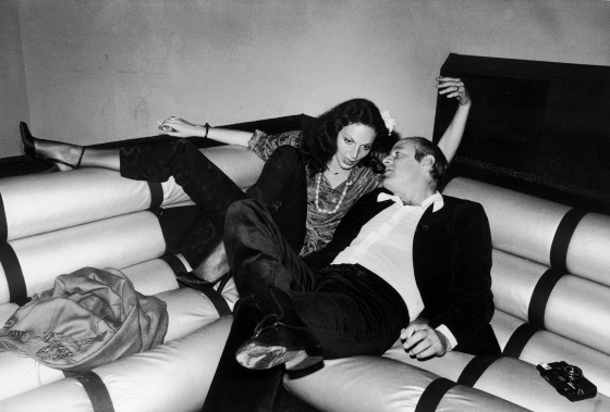 Diane von Furstenberg smiling at a fashion event, wearing her iconic wrap dress.