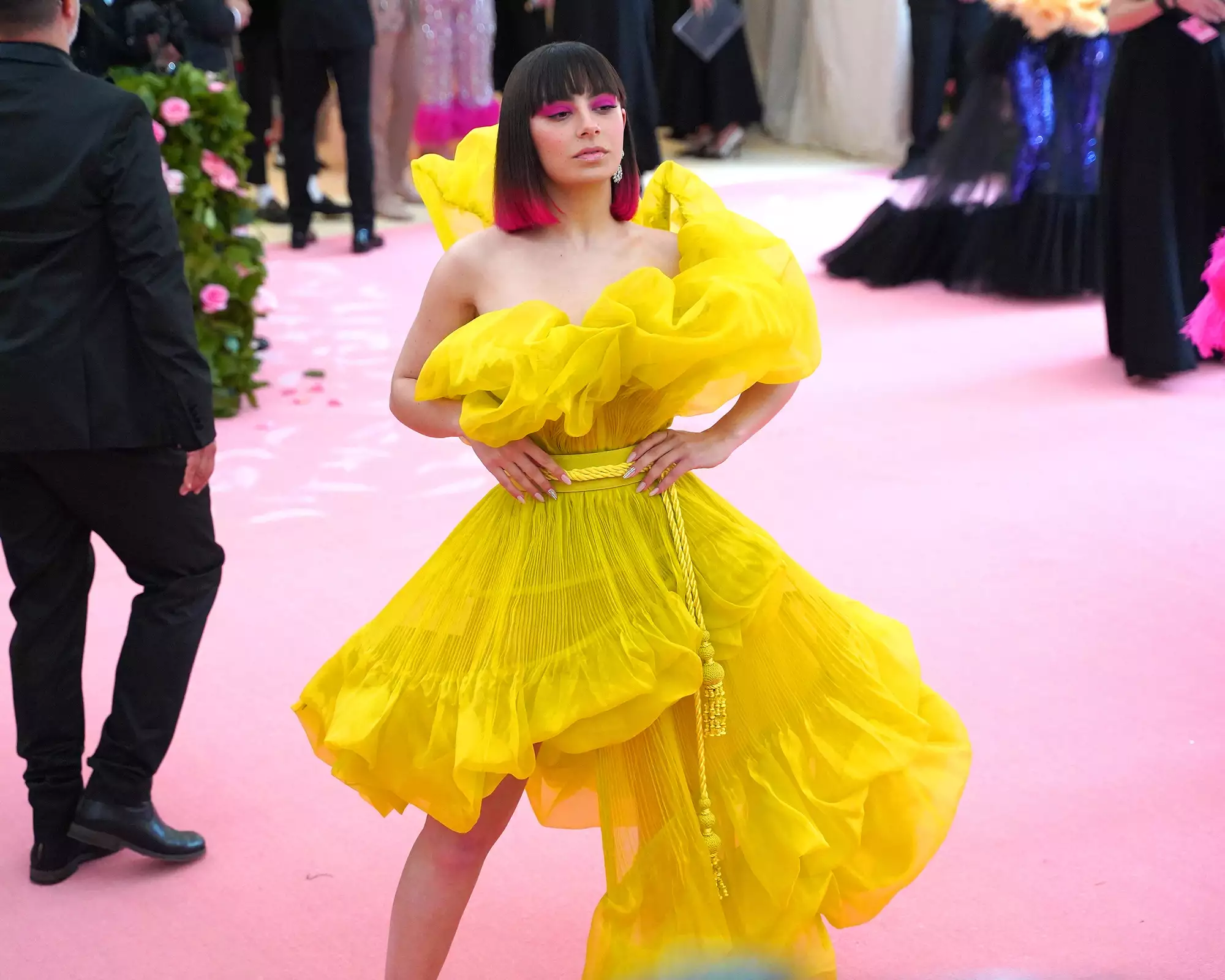 Charli XCX Met Gala 2025 look in a gothic feathered suit and sheer skirt