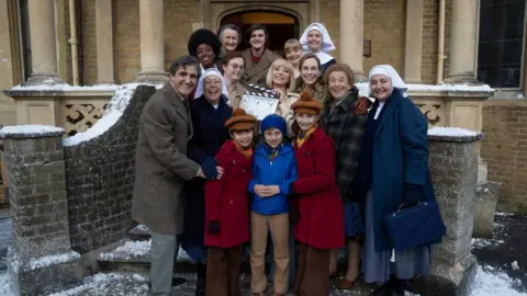 The cast of Call the Midwife in a dramatic scene from the upcoming movie