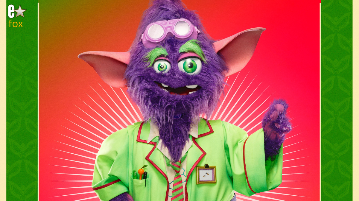 Mad Scientist Monster Masked Singer character performing on stage.
