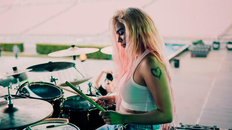 Karol G performing on stage during her world tour