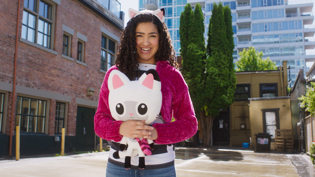 Gabby's Dollhouse Movie promotional image featuring Gabby and her magical dollhouse