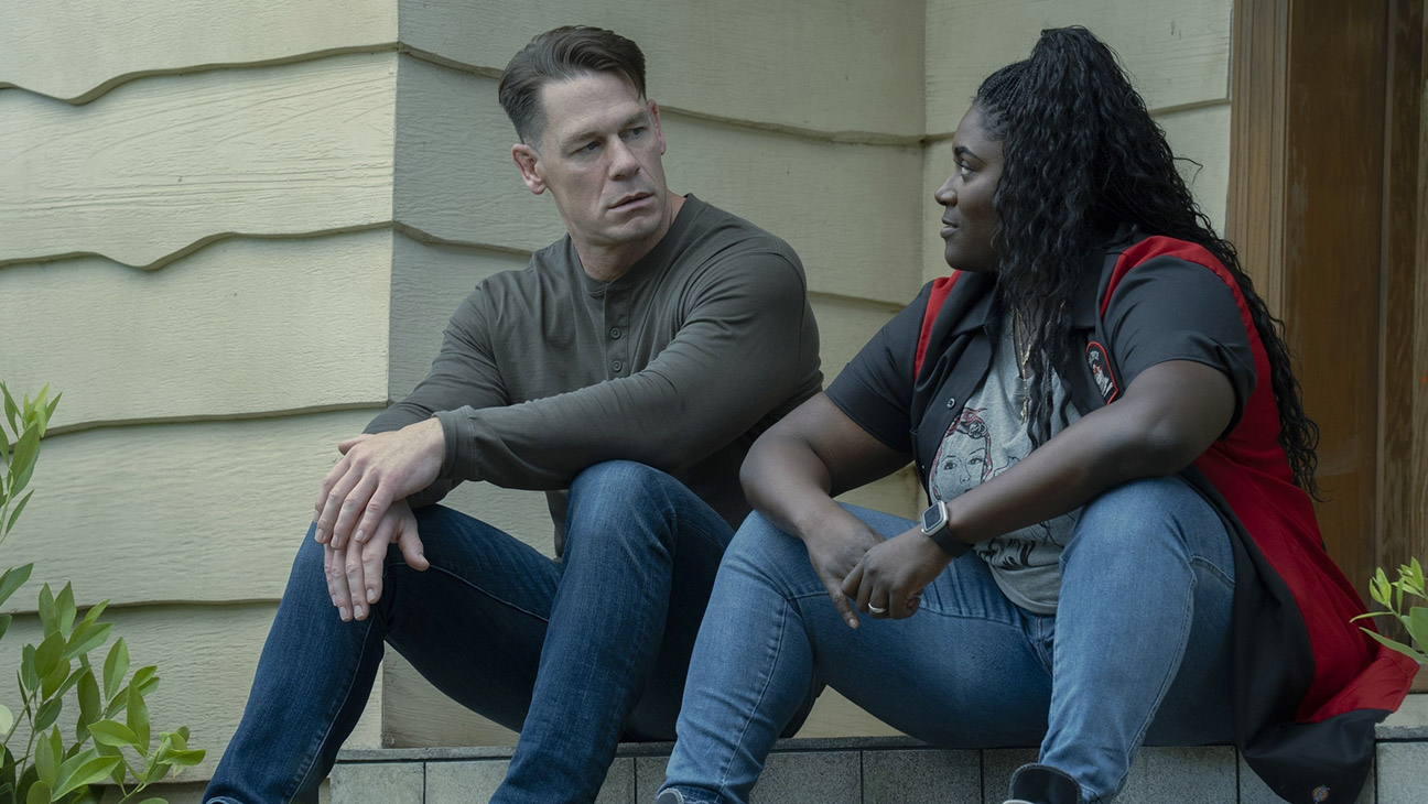 John Cena returns as Peacemaker in Season 2, flanked by key cast members.