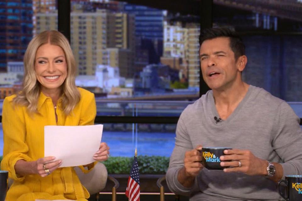 Kelly Ripa laughing on set with Mark Consuelos