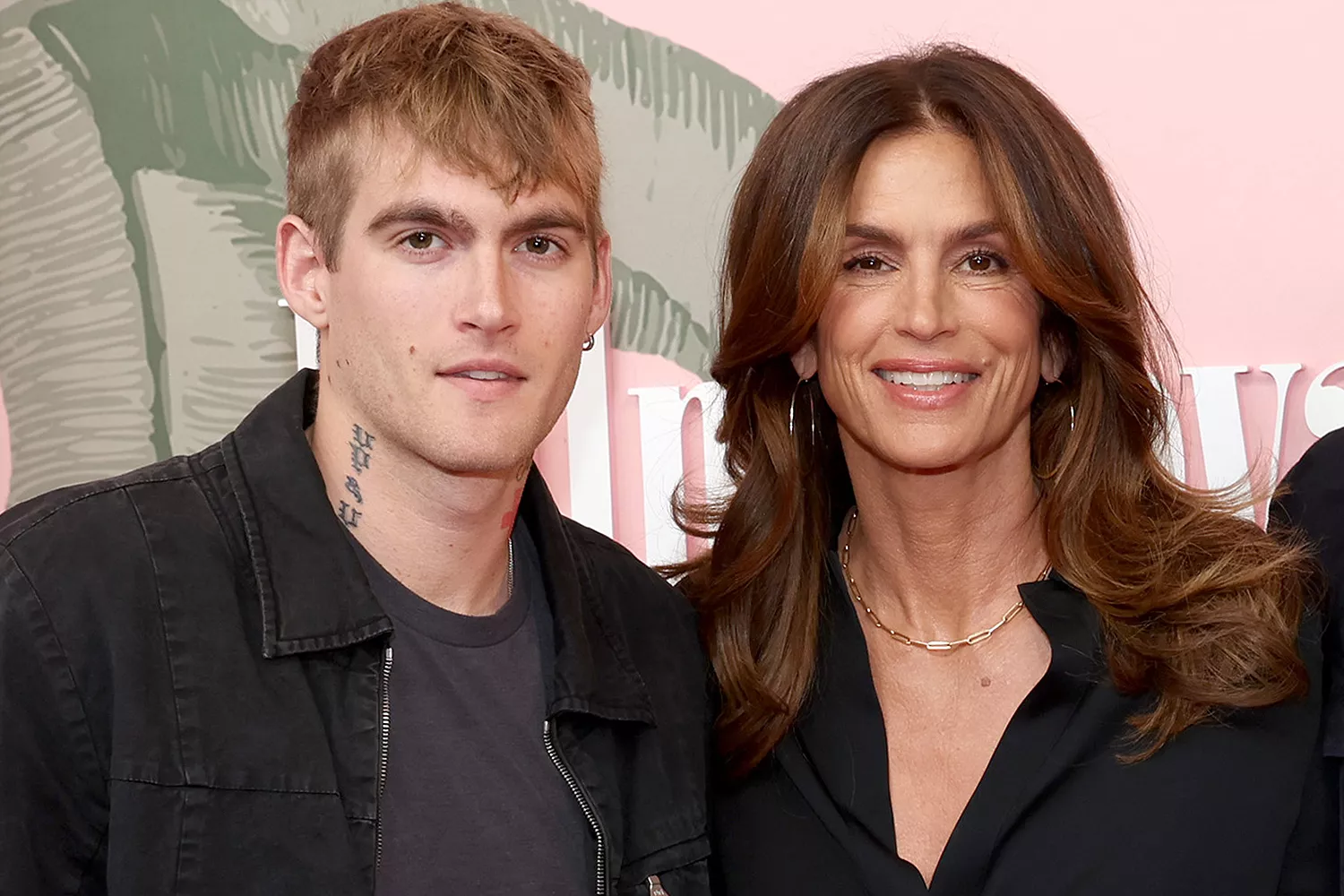 Cindy Crawford posing with her family, showcasing her timeless presence and fashion influence