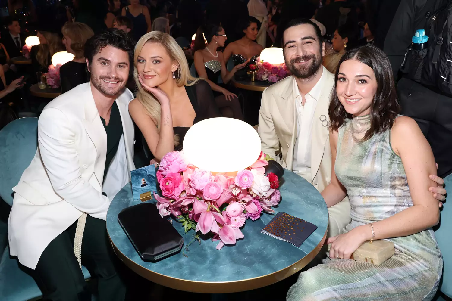 Chase Stokes and Kelsea Ballerini pose on the 2025 ACM Awards red carpet