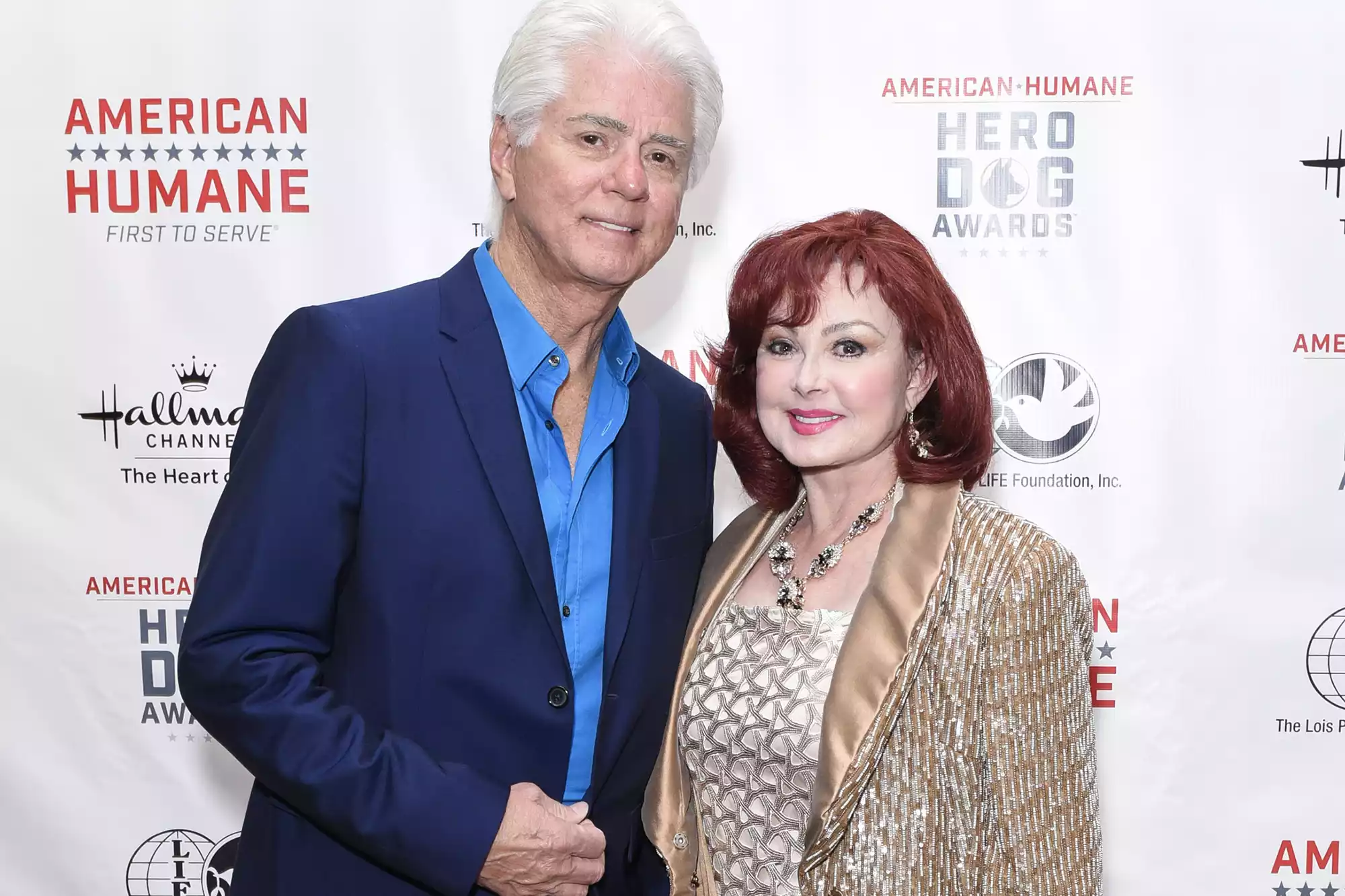 Larry Strickland and Naomi Judd together on stage, showcasing the strength of their partnership in country music