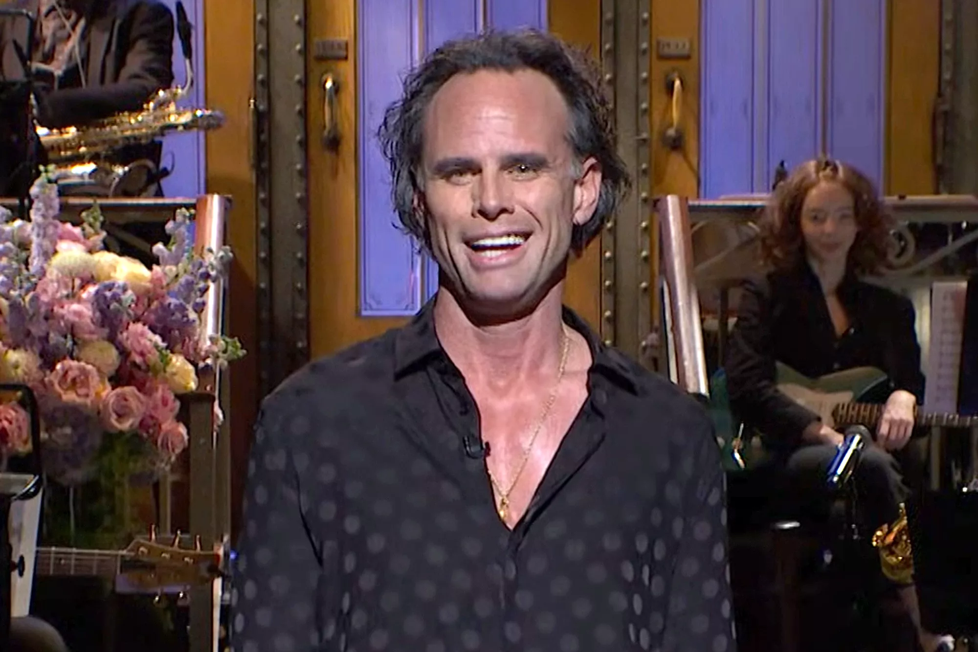 Walter Goggins on SNL set, smiling in studio environment