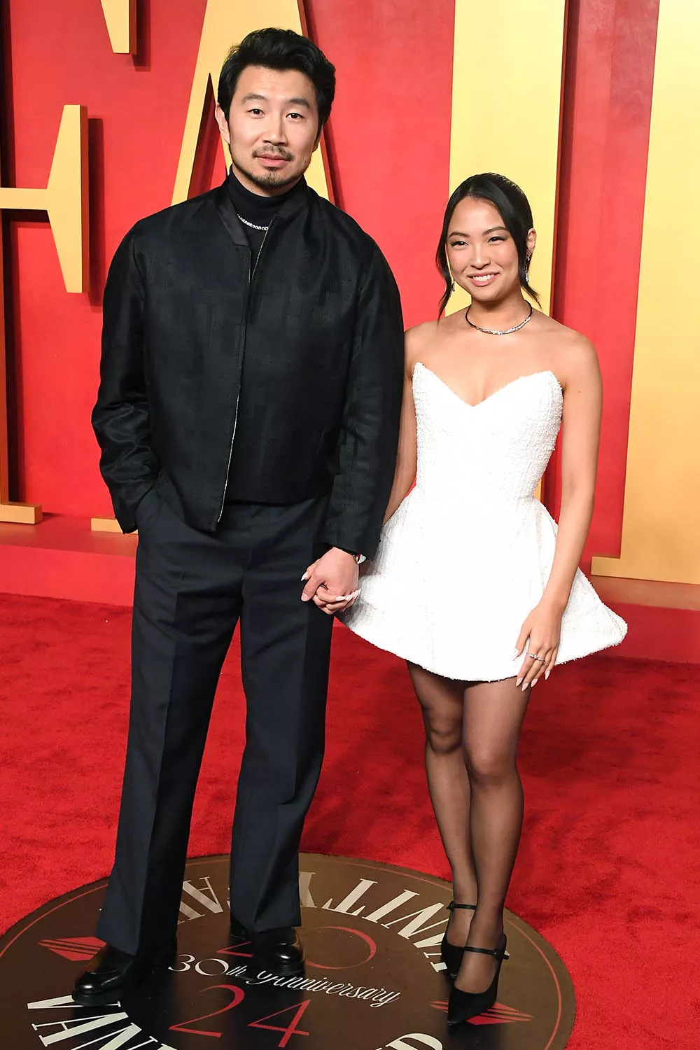 Allison Hsu and Simu Liu celebrating their engagement in Paris