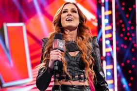 Becky Lynch posing triumphantly in WWE attire