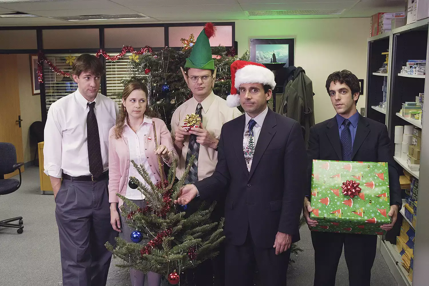 Cast of The Paper Office Spinoff gathered in a newsroom setting