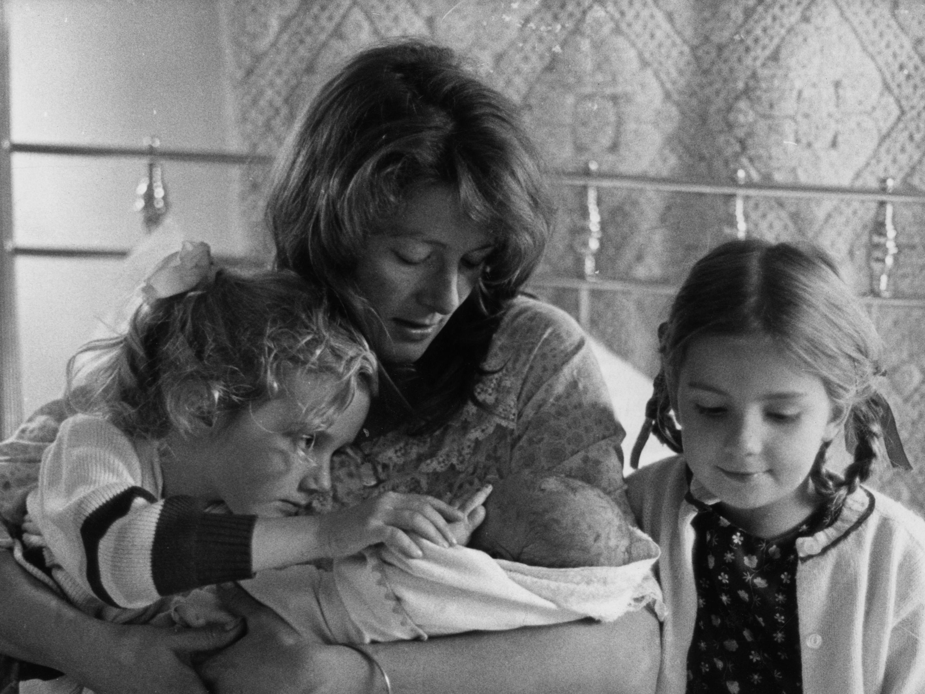 Natasha Richardson with her family at a public event, symbolizing her enduring legacy.