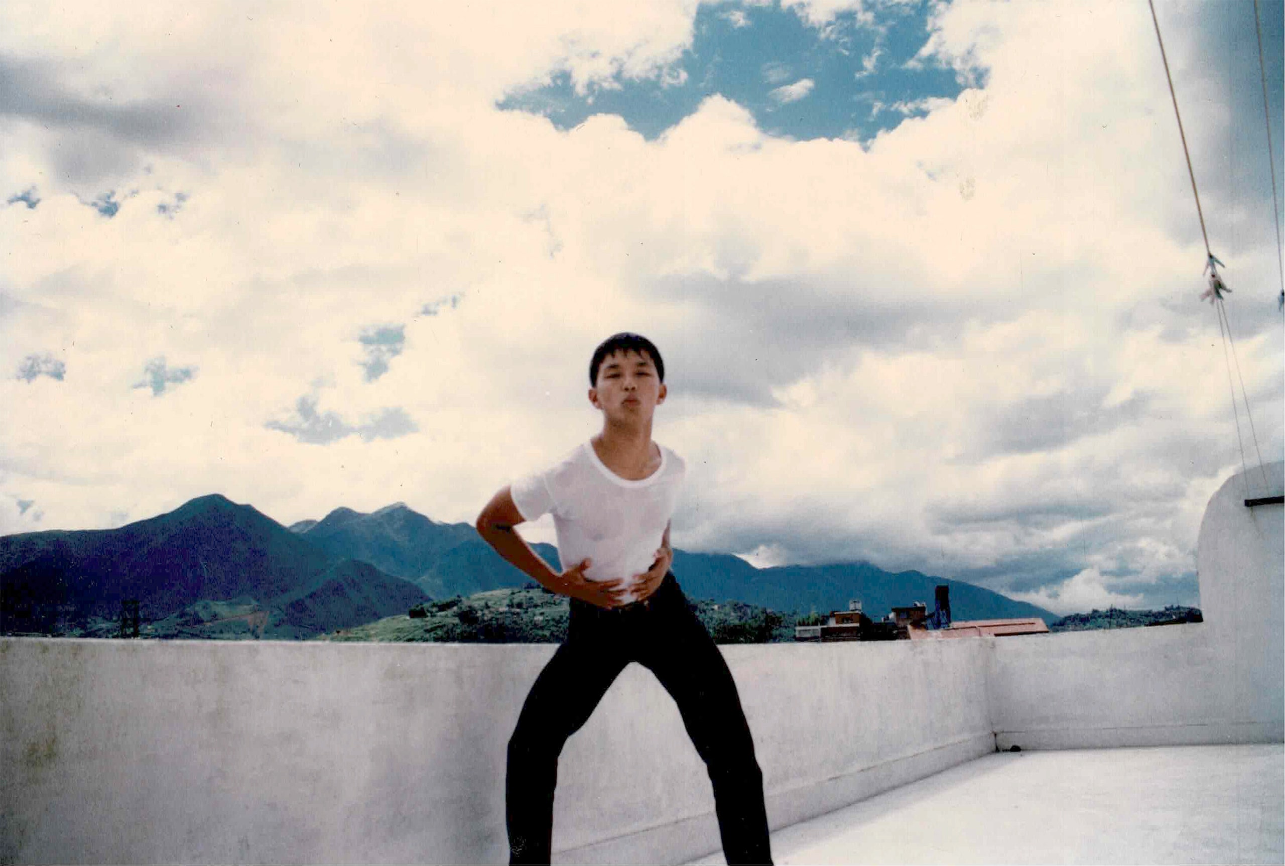 Prabal Gurung posing in a designer outfit