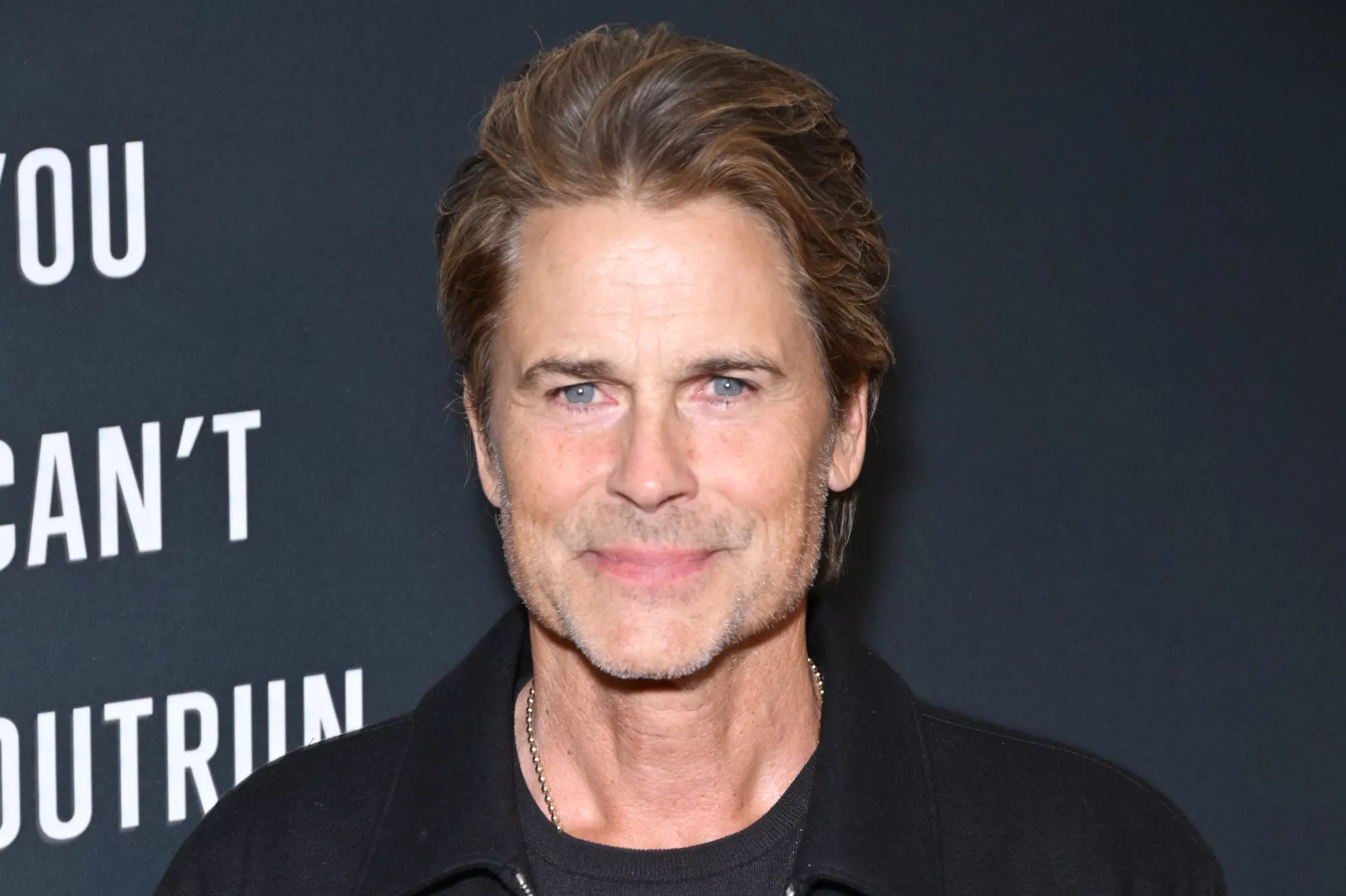 Rob Lowe smiling at a public event