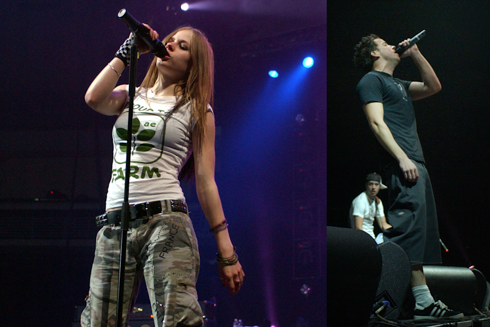 Avril Lavigne performing on stage with vibrant lighting