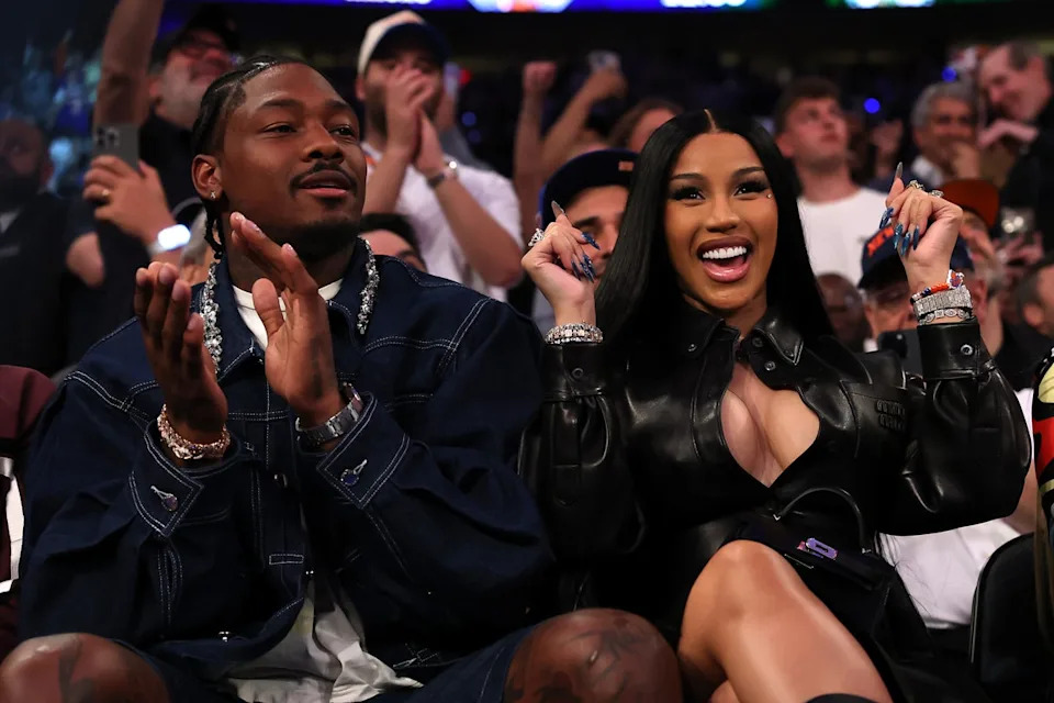 Stefon Diggs at an event, smiling courtside | who is stefon diggs