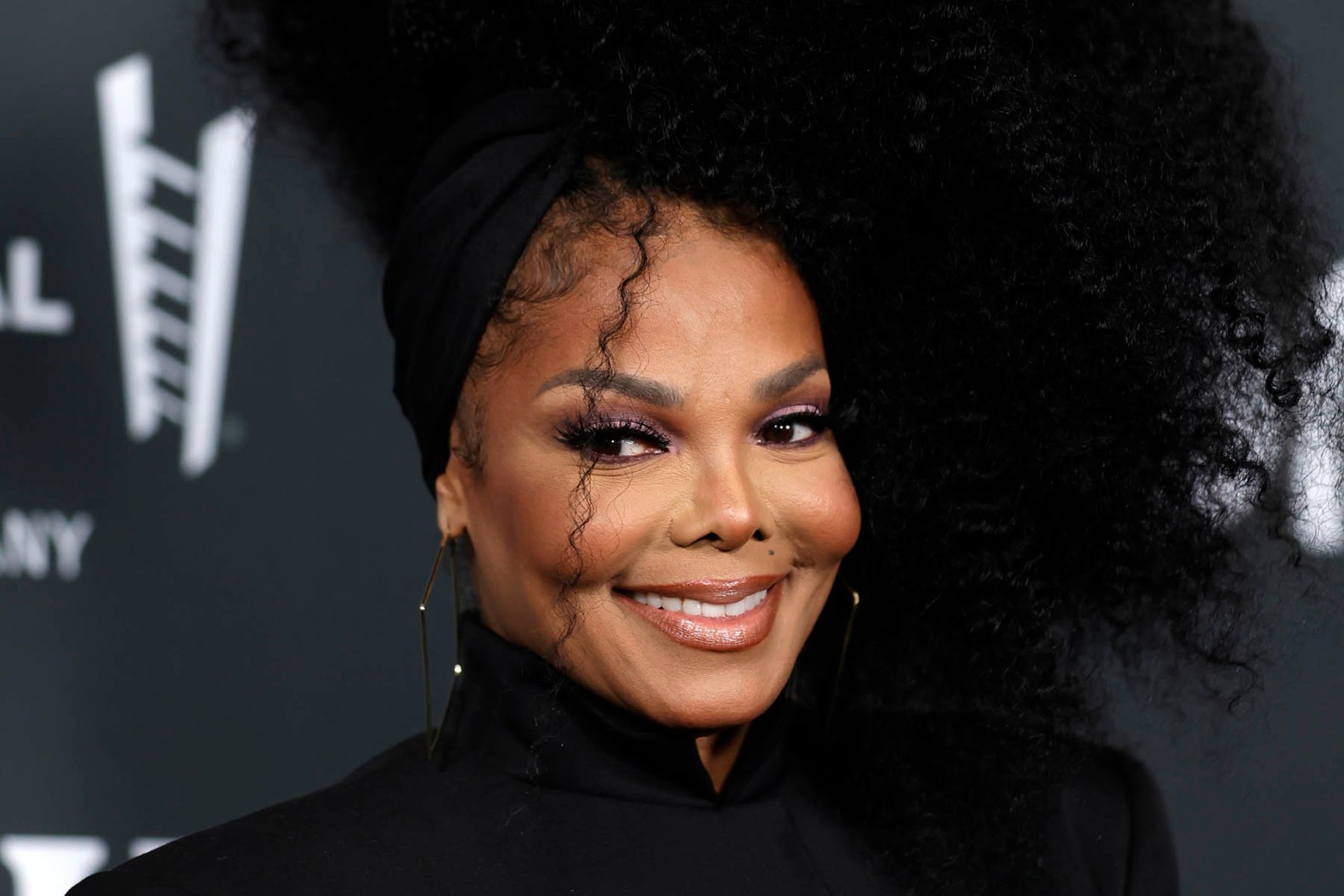 Janet Jackson performing on stage at a previous event