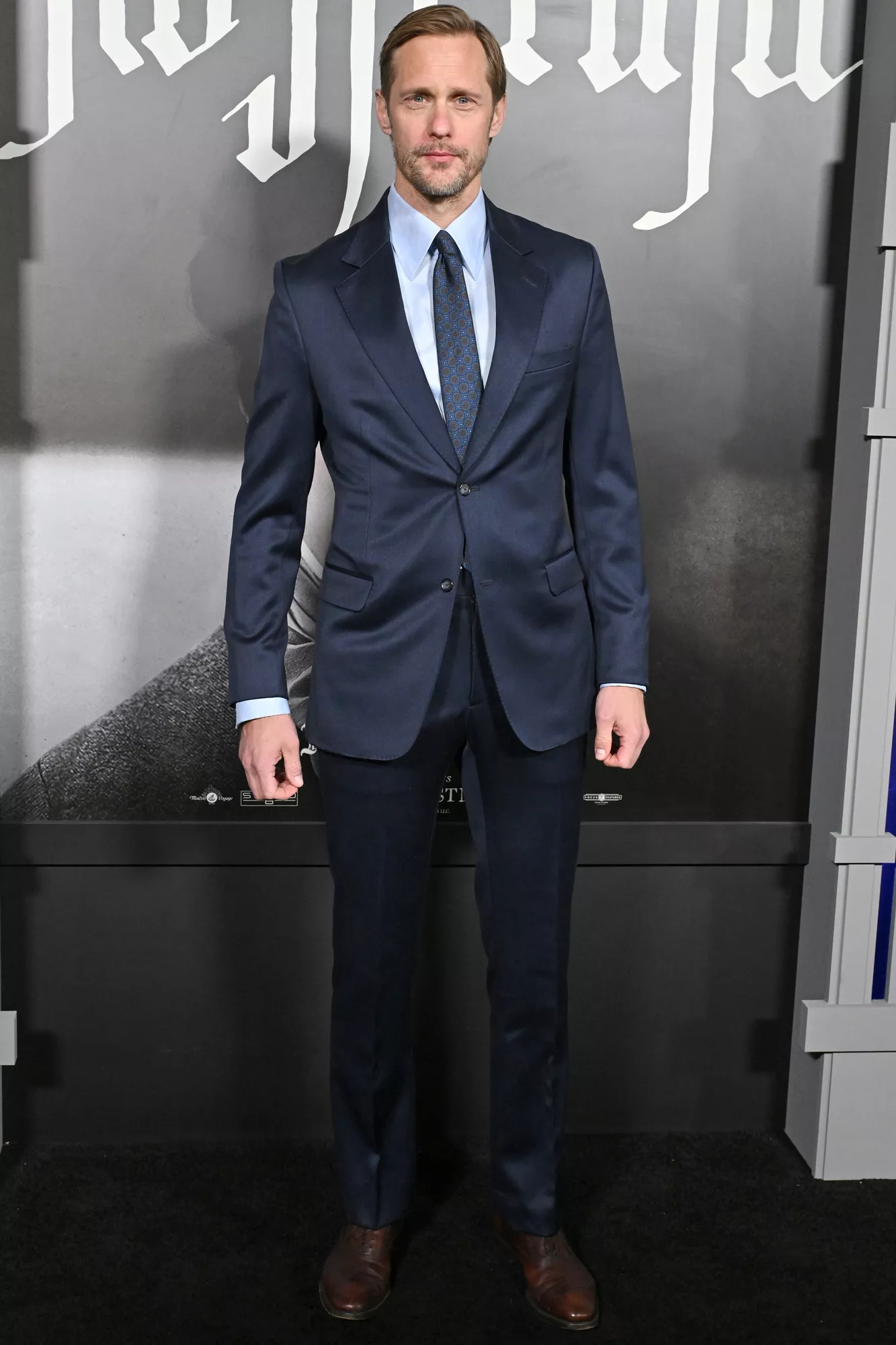 Alexander Skarsgard arriving at a talk show in a vintage tracksuit