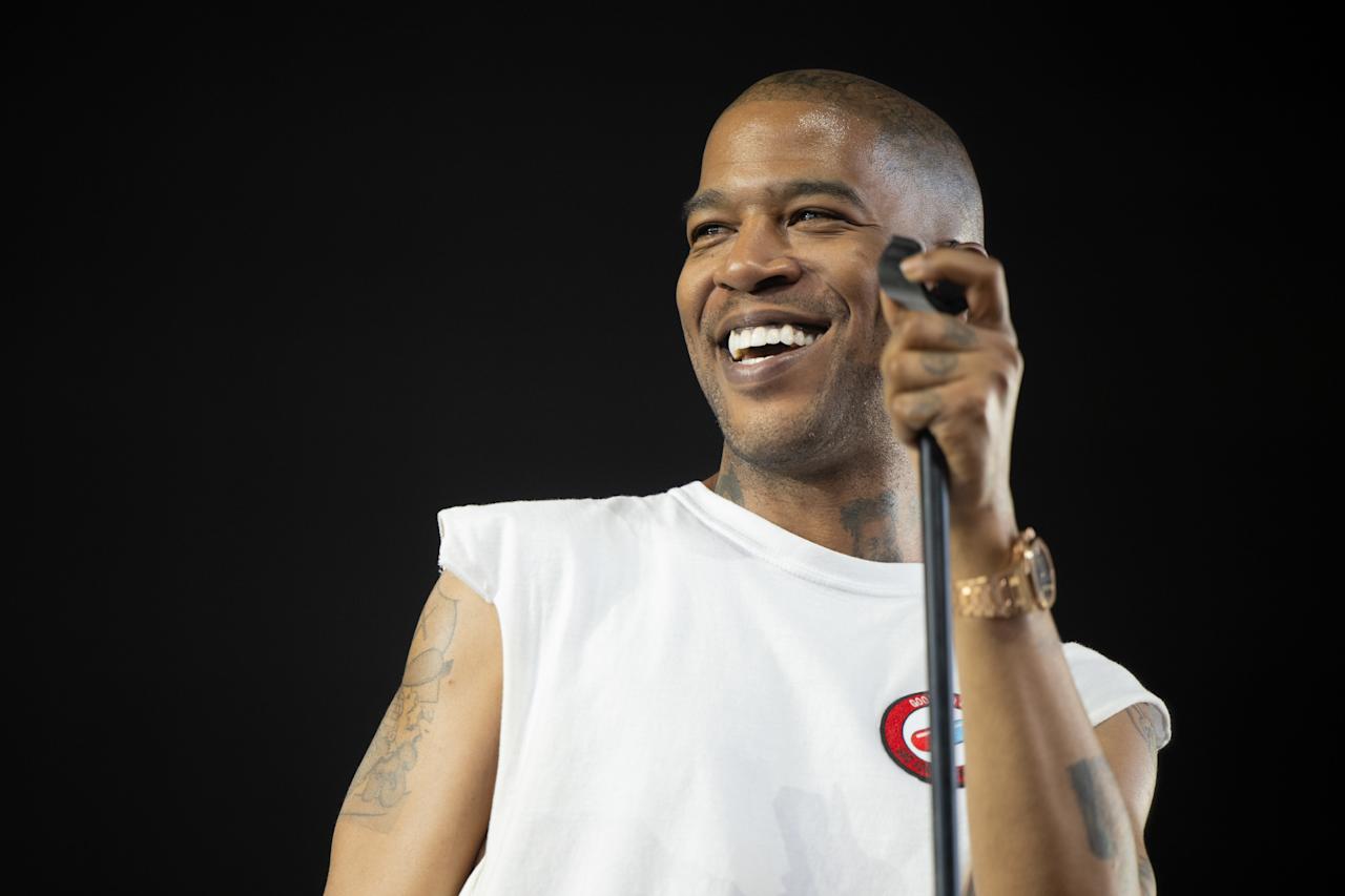 Kid Cudi performing live at a music festival.