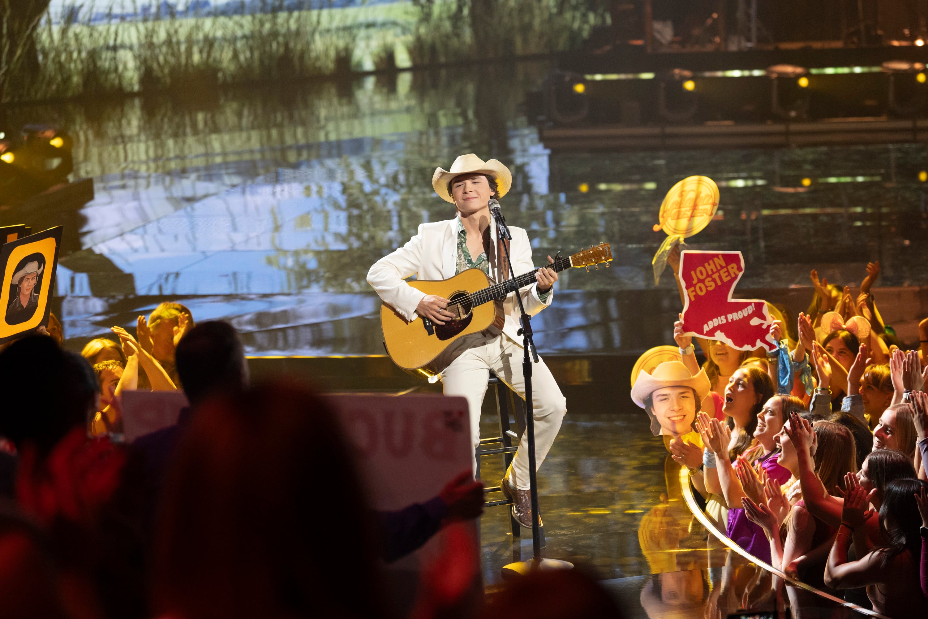 American Idol contestant performing live on stage in 2025