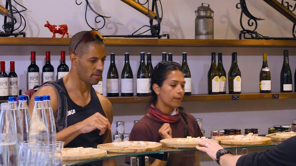 Contestants on The Amazing Race tackling a final challenge