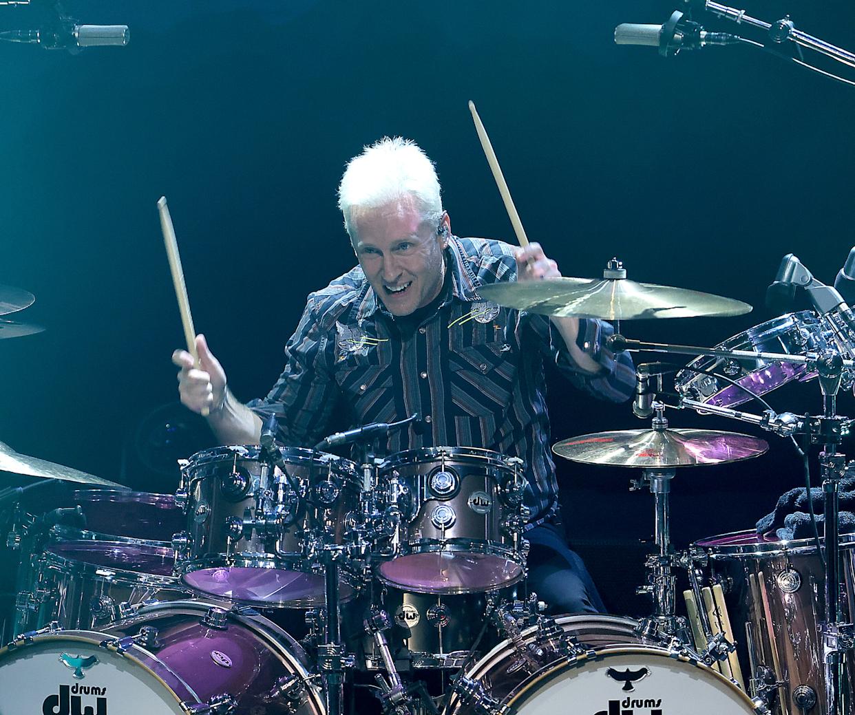 Josh Freese performing live behind drum kit