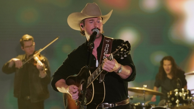 Riley Green performing live, capturing the energy and spirit of country music