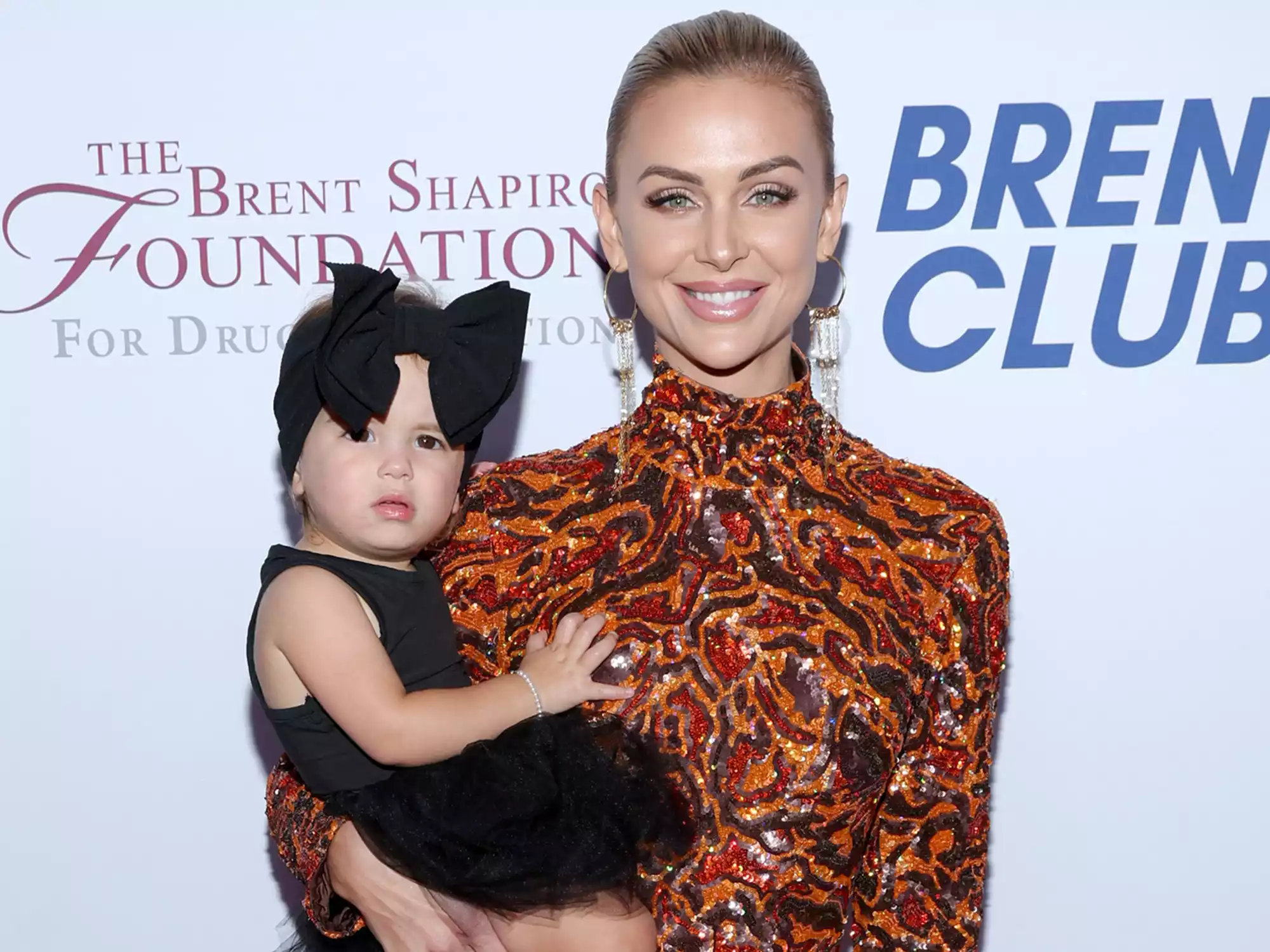 Lala Kent from Vanderpump Rules smiling at an event