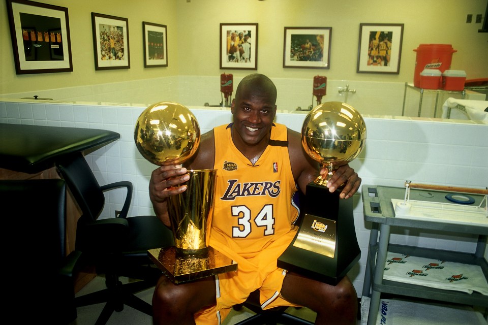 Shaq smiling at a business event, exemplifying his successful post-NBA career