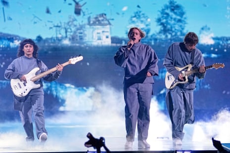 Eurovision live stage with vibrant performers and audience cheering