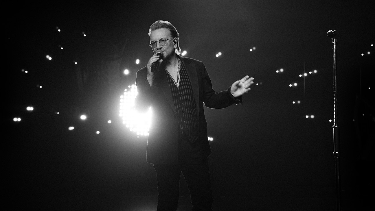 Bono performing on stage during 'Stories of Surrender'