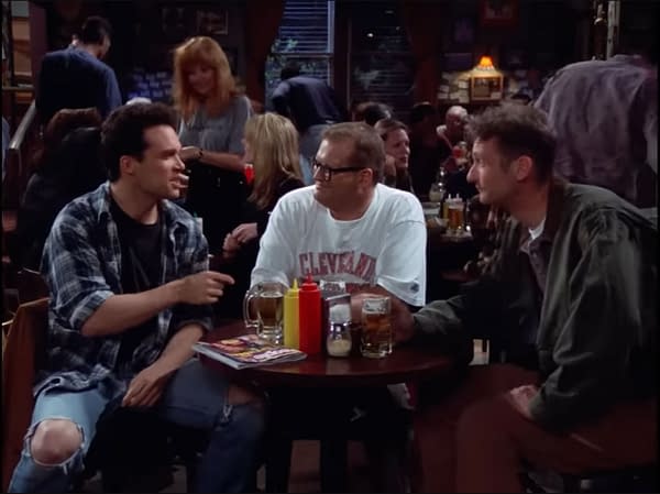 Drew Carey on set during The Drew Carey Show, captured in a candid moment.