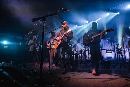 Zach Bryan on stage during a recent country music performance