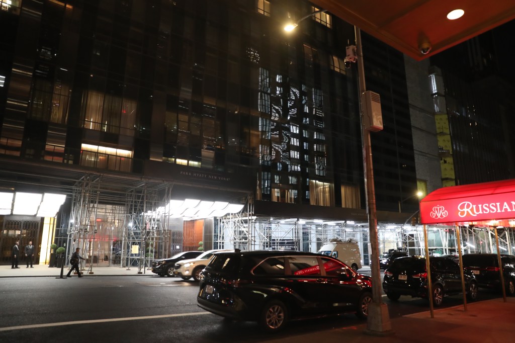 A New York hotel room tied to a celebrity arrest, featuring evidence bags and cash