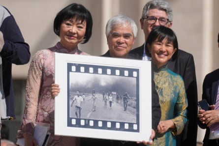 A historic photo often referred to as 'napalm girl', showing children fleeing a napalm attack during the Vietnam War.